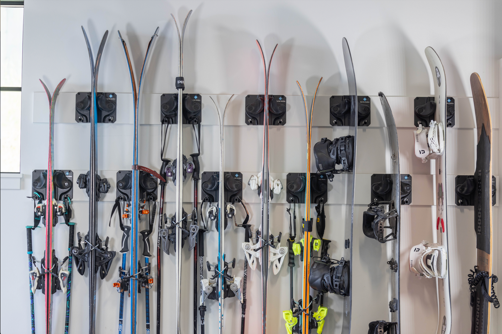 11 pairs of skis hang in Gravity Grabbers
